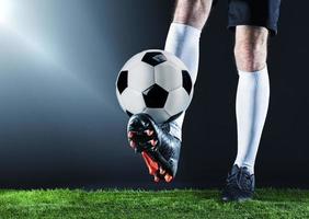 Football. Soccer. Soccer player dribbling with ball photo