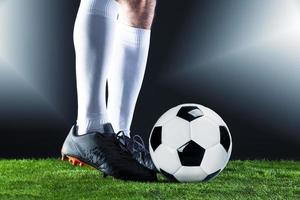 Football. Soccer. Soccer player dribbling with ball photo