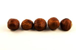 Fresh chestnuts on white background photo