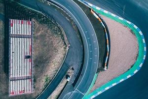 Aerial top down drone view of a racing track with tight turns and hairpins photo