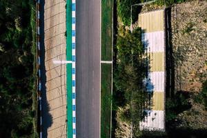 Aerial top down drone view of a racing track with tight turns and hairpins photo