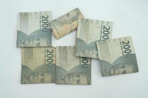 2000 Indonesian Rupiah notes isolated on white background photo