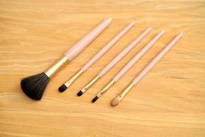 Set of makeup brushes with Wood Background photo