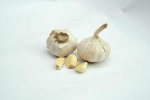 Garlic clove and bulb isolated on white background photo