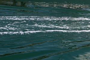 The color of the water in the mediterranean sea in shallow water photo