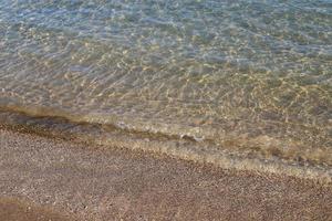 The color of the water in the mediterranean sea in shallow water photo