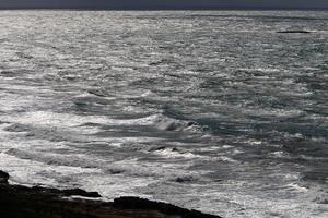 The color of the water in the mediterranean sea in shallow water photo