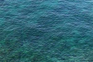 The color of the water in the mediterranean sea in shallow water photo