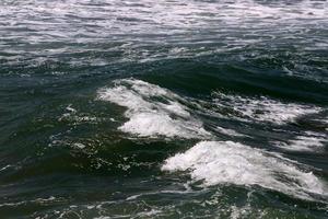 The color of the water in the mediterranean sea in shallow water photo