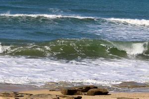 The color of the water in the mediterranean sea in shallow water photo