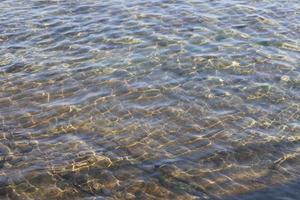 The color of the water in the mediterranean sea in shallow water photo