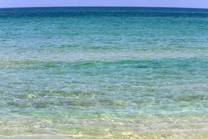 The color of the water in the mediterranean sea in shallow water photo