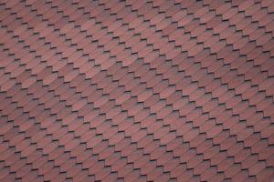 Decorative metal tile on a roof photo