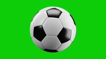 balón de fútbol giratorio aislado muy realista sobre un fondo verde. Animación en bucle infinito.