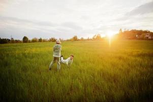 Brothers running and having fun together at meadow. photo