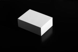 white box on a black background. carton moving box photo