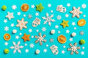 Top view of blue background with New Year toys and decorations. Christmas time concept photo