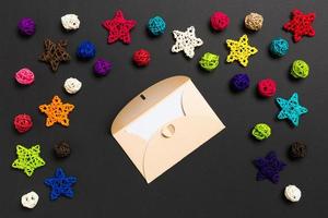 Top view of envelope on black background. New Year decorations. Christmas holiday concept photo