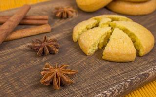 Board with cookie. Cinnamon sticks with star anise. photo