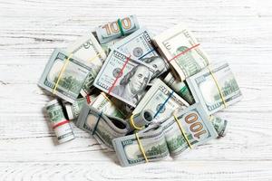 US Dollar bills bundles stack. one hundred dollar bills with stack of money in the middle. Top view of business concept on background with copy space photo