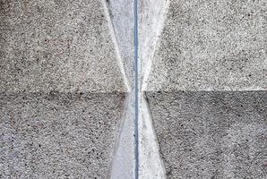 Detailed view on aged concrete walls with cracks and a lot of structure in high resolution photo