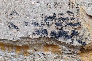 Detailed view on aged concrete walls with cracks and a lot of structure in high resolution photo