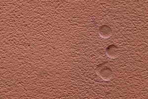 Detailed view on aged concrete walls with cracks and a lot of structure in high resolution photo