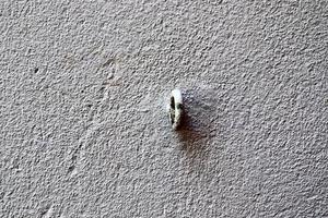 Detailed view on aged concrete walls with cracks and a lot of structure in high resolution photo