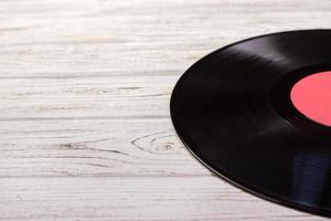 Music background of black gramophone Vinyl record. closeup Empty space for inscription photo