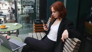 A Red Haired Business Woman Working Outdoors video