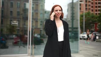 A Red Haired Business Woman Working Outdoors video
