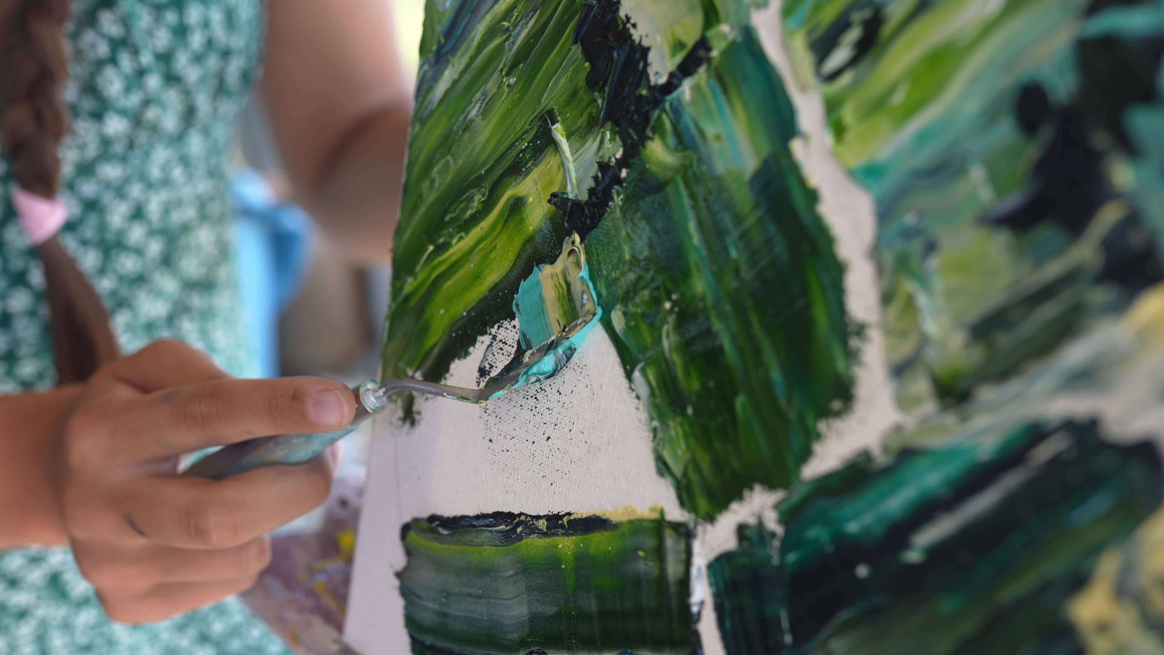 a-woman-painting-in-art-class-13170460-stock-video-at-vecteezy