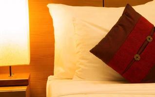 pillow in bed at night photo