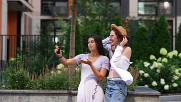 Two women explore city together on a sunny day video