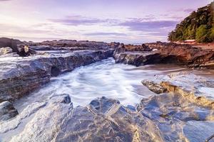 Beach with natural rock photo