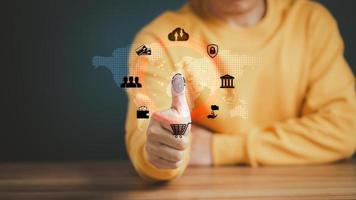Concept of Surveillance and security scanning of digital program cyber futuristic application. Futuristic digital processing of biometric identification fingerprint scanner for access personal data. photo