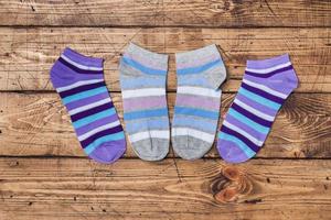 Socks on wooden background. color socks short women's under shoes photo