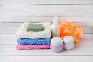 Spa and Wellness concept on white background. Towels cream soap and bath accessories. photo