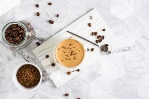 Dalgona coffee in a glass and ingredients for cooking. Social media trendy drink. Top view photo