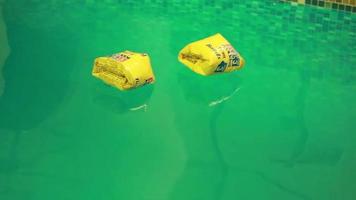 Buoys floating on the calm water in the pool video