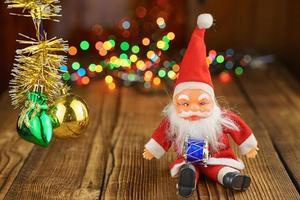 Santa Claus on wooden background beautiful bokeh photo