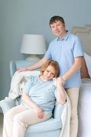 Serene couple man and woman enjoy being together. Sitting in same chair photo