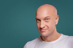 Portrait of a cheerful  man isolated on the blue background photo