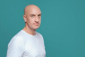 emotional man in white t-shirt with angry facial expression on background, isolation photo