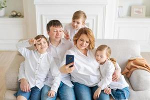 Portrait caucasian cheerful family happy parents and little children taking photo