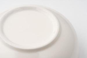 A closeup shot of the underside of a white bowl photo