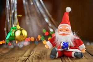 Santa Claus on wooden background beautiful bokeh photo