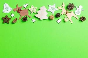 Christmas green background with holiday toys and decorations. Happy New Year concept with empty space for your design photo