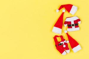 Top view od stylish red Santa hats on colorful background. Merry Christmas concept with copy space photo