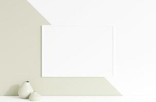 Clean and minimalist front view horizontal white photo or poster frame mockup hanging on the wall with vase. 3d rendering.